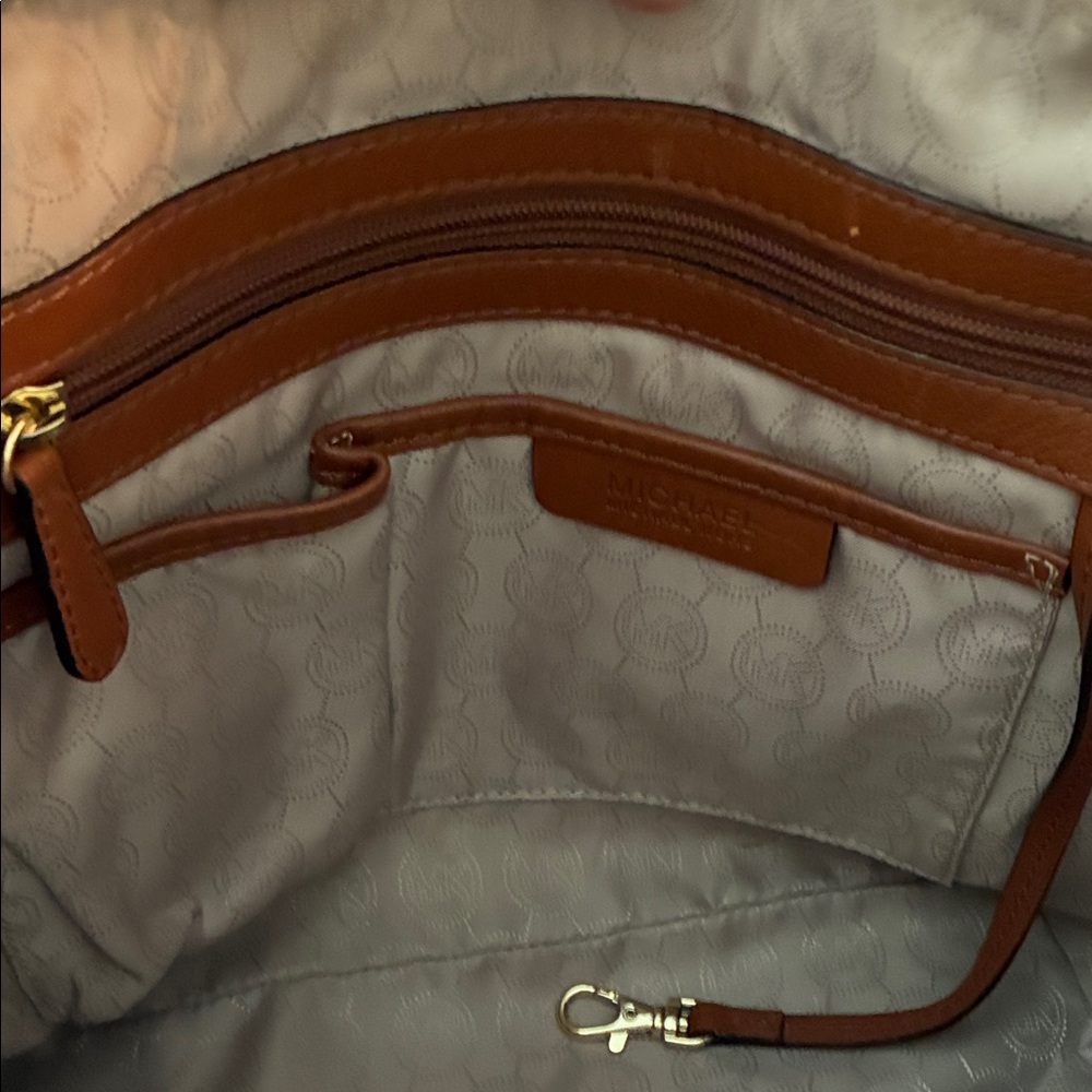 Michael Kors brown shoulder handbag .